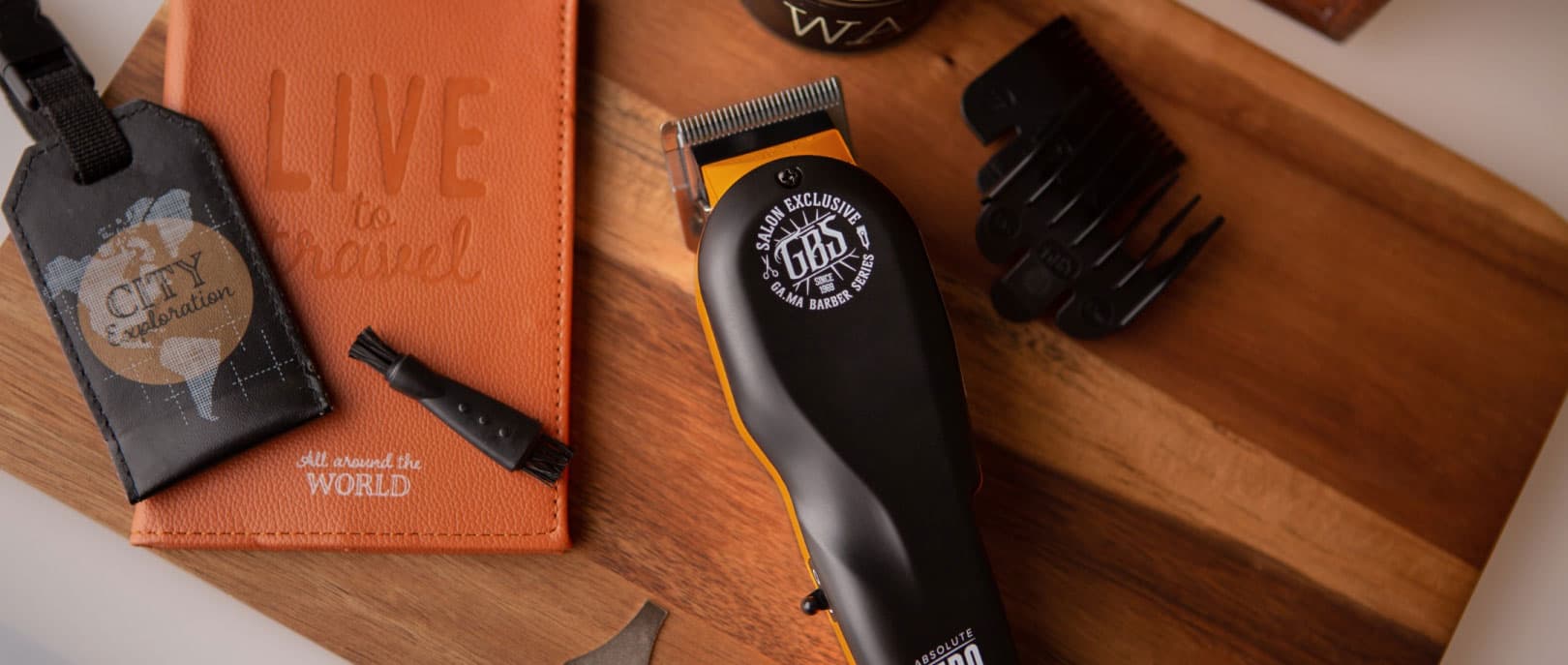 Clippers, guards and combs laid out on the counter